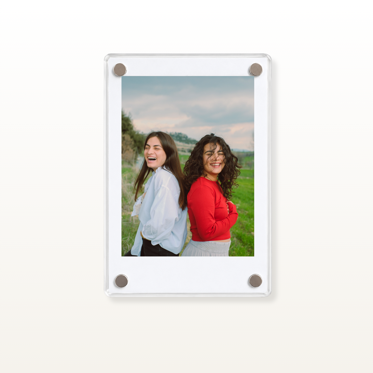 Personalised Polaroid-style photo print displayed in a clear magnetic frame, featuring a family photograph.